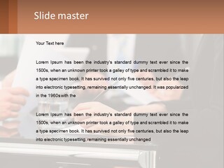 A Group Of People Sitting At A Table Writing On Paper PowerPoint Template