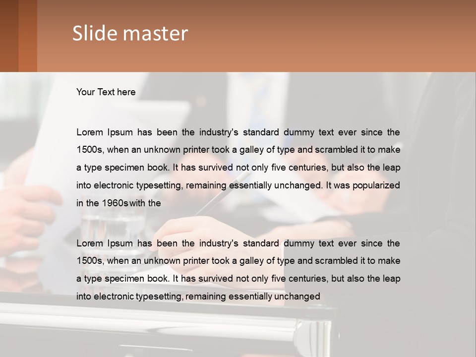 A Group Of People Sitting At A Table Writing On Paper PowerPoint Template