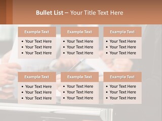 A Group Of People Sitting At A Table Writing On Paper PowerPoint Template