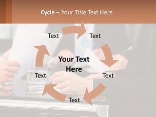 A Group Of People Sitting At A Table Writing On Paper PowerPoint Template