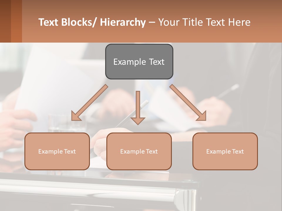 A Group Of People Sitting At A Table Writing On Paper PowerPoint Template