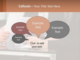 A Group Of People Sitting At A Table Writing On Paper PowerPoint Template