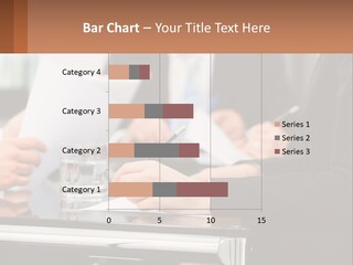 A Group Of People Sitting At A Table Writing On Paper PowerPoint Template