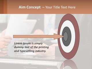 A Group Of People Sitting At A Table Writing On Paper PowerPoint Template