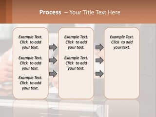 A Group Of People Sitting At A Table Writing On Paper PowerPoint Template