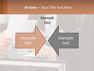 A Group Of People Sitting At A Table Writing On Paper PowerPoint Template