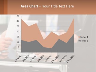 A Group Of People Sitting At A Table Writing On Paper PowerPoint Template