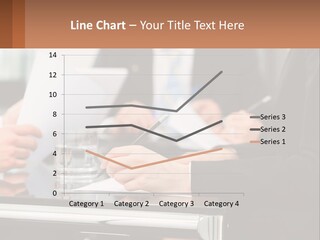 A Group Of People Sitting At A Table Writing On Paper PowerPoint Template