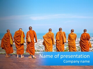 A Group Of Monks Standing On Top Of A Wooden Platform PowerPoint Template