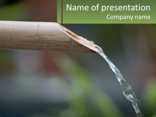 A Wooden Pipe With Water Coming Out Of It PowerPoint Template