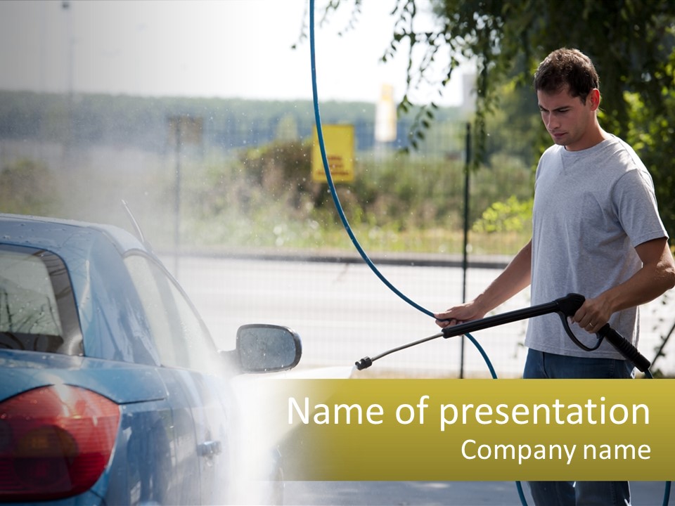 A Man Is Washing A Car With A Hose PowerPoint Template