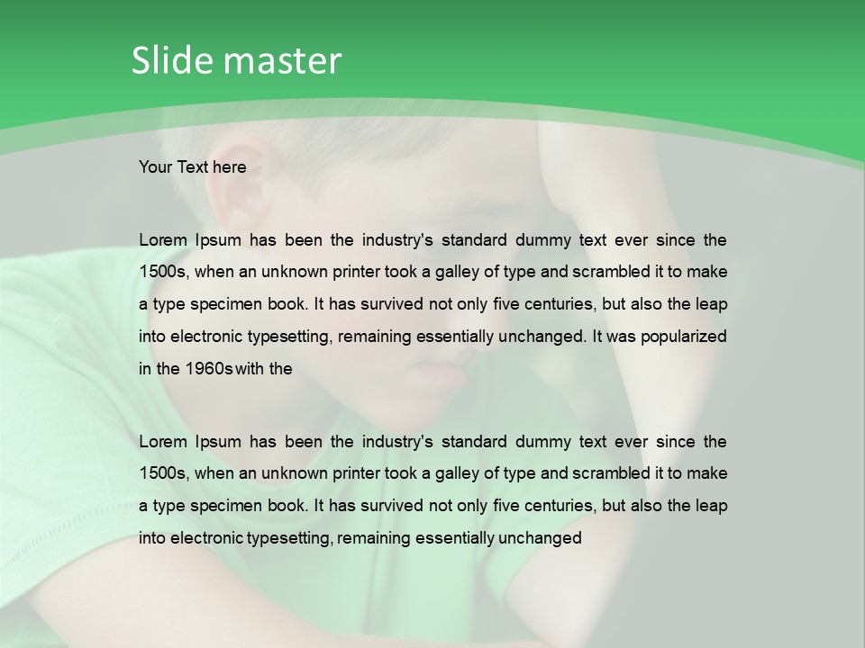 A Young Boy Sitting In Front Of A Laptop Computer PowerPoint Template