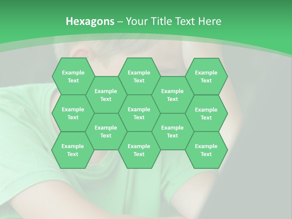 A Young Boy Sitting In Front Of A Laptop Computer PowerPoint Template