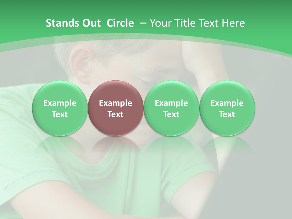 A Young Boy Sitting In Front Of A Laptop Computer PowerPoint Template