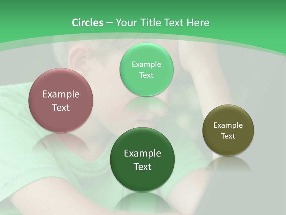 A Young Boy Sitting In Front Of A Laptop Computer PowerPoint Template