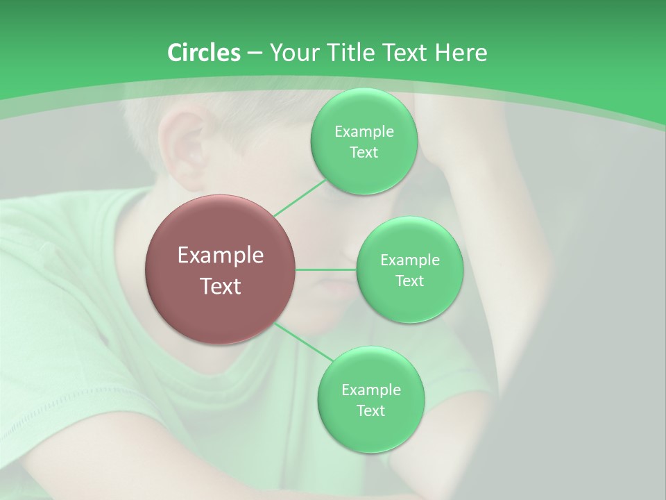 A Young Boy Sitting In Front Of A Laptop Computer PowerPoint Template