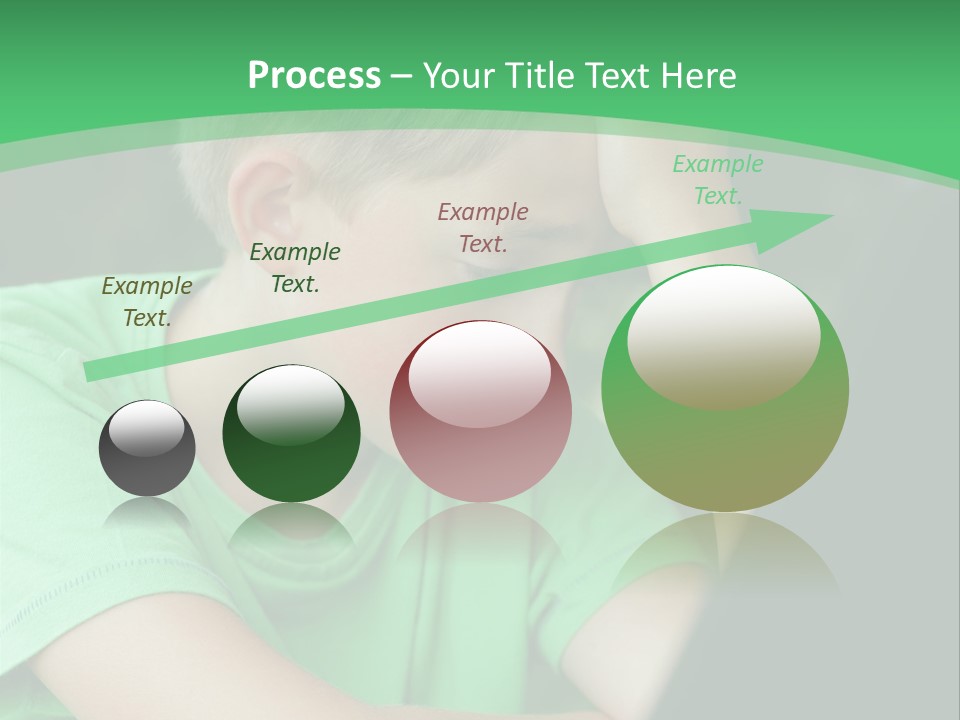 A Young Boy Sitting In Front Of A Laptop Computer PowerPoint Template