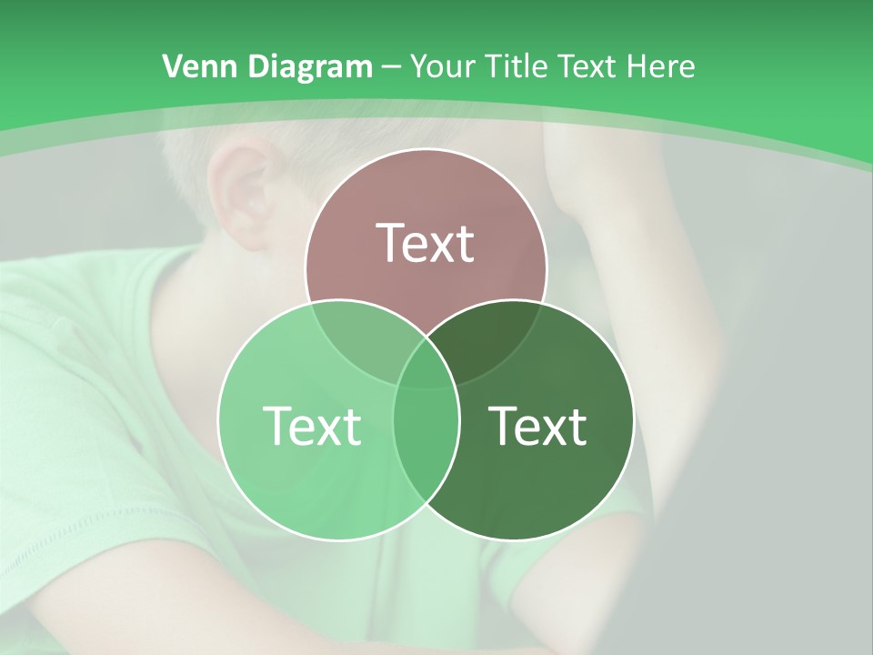 A Young Boy Sitting In Front Of A Laptop Computer PowerPoint Template