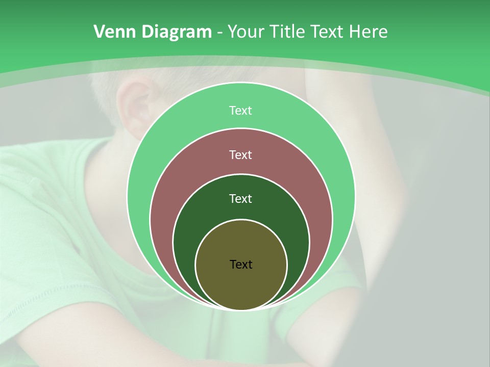 A Young Boy Sitting In Front Of A Laptop Computer PowerPoint Template