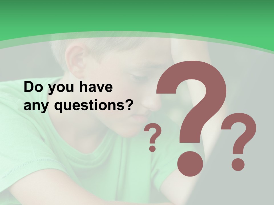 A Young Boy Sitting In Front Of A Laptop Computer PowerPoint Template