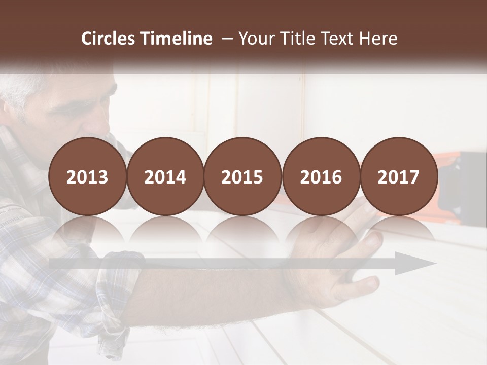 A Man Measuring A Wall With A Spirit Level PowerPoint Template