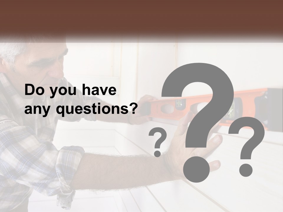 A Man Measuring A Wall With A Spirit Level PowerPoint Template