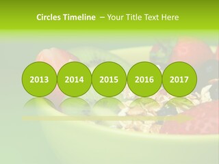 A Bowl Of Fruit Is Shown With A Green Background PowerPoint Template