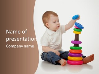 A Baby Playing With A Stack Of Colorful Toys PowerPoint Template