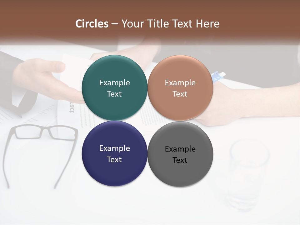 Two People Sitting At A Table Signing Papers PowerPoint Template