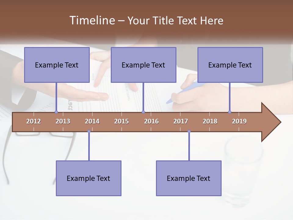 Two People Sitting At A Table Signing Papers PowerPoint Template