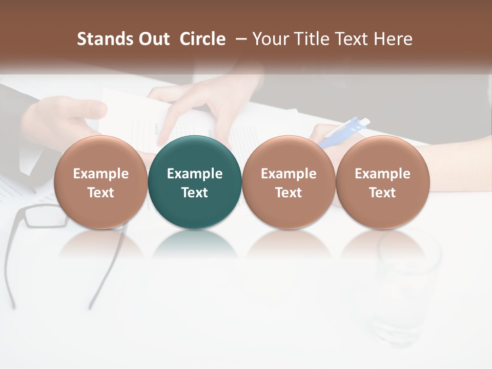 Two People Sitting At A Table Signing Papers PowerPoint Template