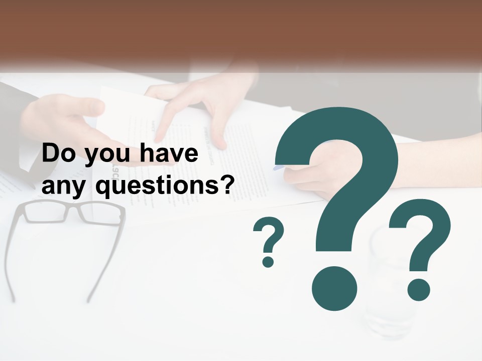 Two People Sitting At A Table Signing Papers PowerPoint Template