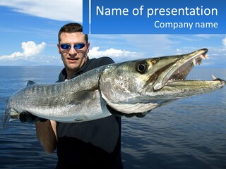 A Man Holding A Large Fish On A Boat PowerPoint Template