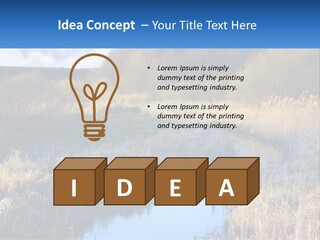 A River Running Through A Lush Green Field PowerPoint Template