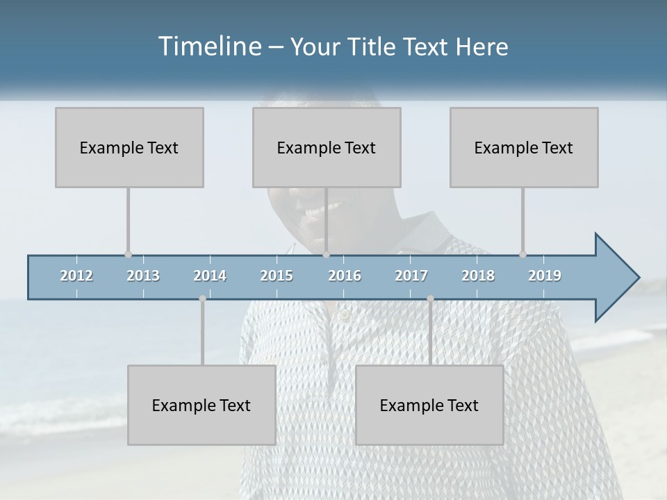 A Man Standing On A Beach With The Ocean In The Background PowerPoint Template