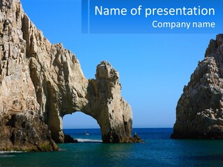 A Large Rock Formation In The Middle Of A Body Of Water PowerPoint Template