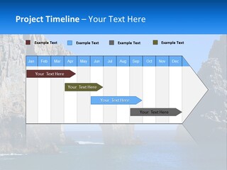 A Large Rock Formation In The Middle Of A Body Of Water PowerPoint Template