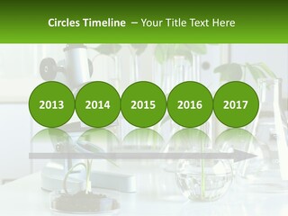 A Microscope And Some Plants On A Table PowerPoint Template