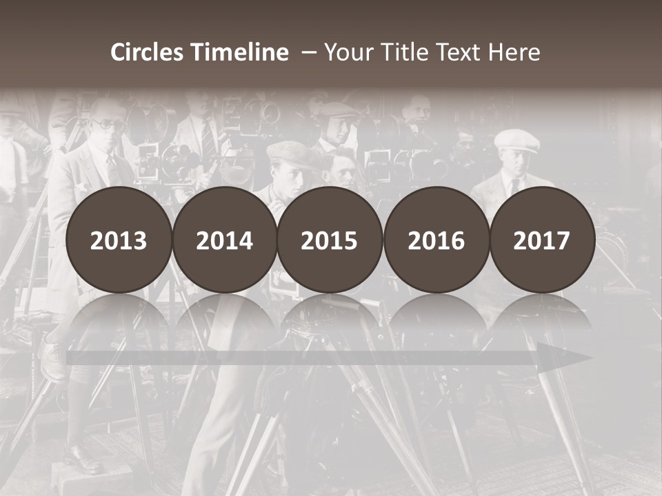 A Group Of People Standing Around A Camera PowerPoint Template