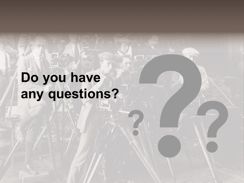 A Group Of People Standing Around A Camera PowerPoint Template