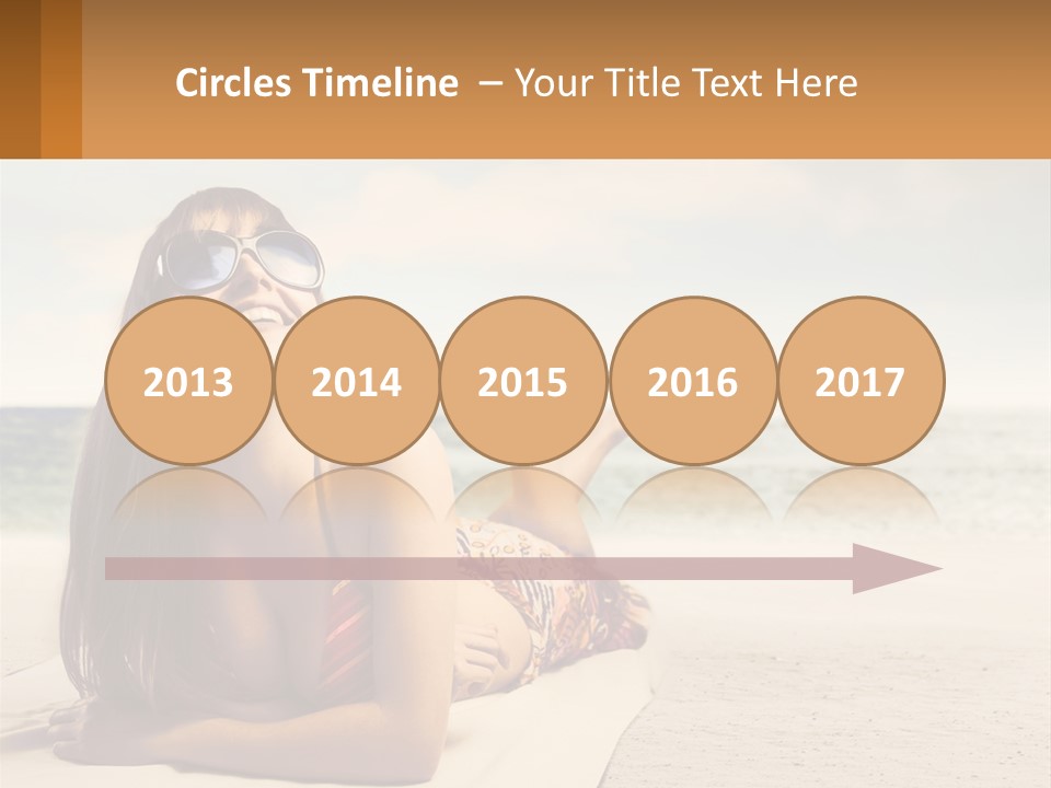 A Woman Laying On The Beach With Sunglasses On Her Head PowerPoint Template