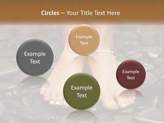 A Woman's Bare Feet On Rocks With A Name Plate PowerPoint Template