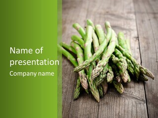 A Pile Of Asparagus On A Wooden Table PowerPoint Template