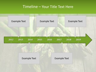 A Pile Of Asparagus On A Wooden Table PowerPoint Template