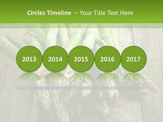 A Pile Of Asparagus On A Wooden Table PowerPoint Template