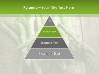 A Pile Of Asparagus On A Wooden Table PowerPoint Template