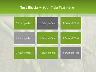 A Pile Of Asparagus On A Wooden Table PowerPoint Template