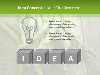 A Pile Of Asparagus On A Wooden Table PowerPoint Template