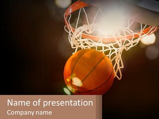 A Basketball Going Through The Net Of A Basketball Hoop PowerPoint Template