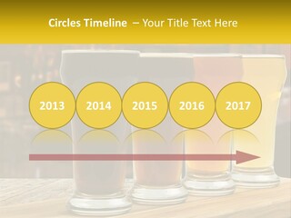 A Row Of Beer Glasses Sitting On Top Of A Wooden Table PowerPoint Template